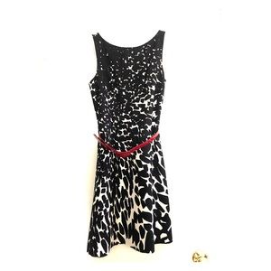 Black and white dress with contrasting red belt